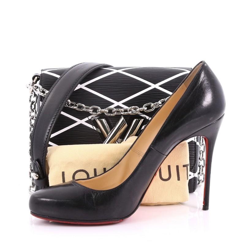 This Louis Vuitton Twist Handbag Limited Edition Malletage Epi Leather PM, crafted from black and white malletage epi leather, features a chain link strap with leather pad, a waved base silhouette, and silver-tone hardware accents. Its twist-lock