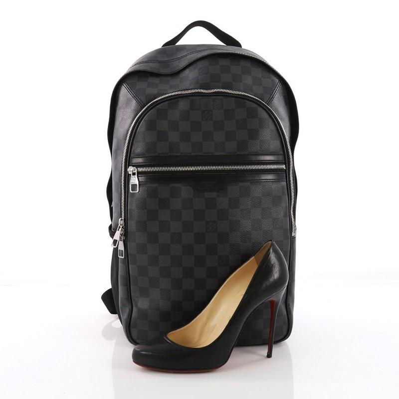 This Louis Vuitton Michael Backpack Damier Graphite, crafted from damier graphite coated canvas, features two canvas padded backpack straps, two exterior front zip pockets, one compartment with slip pockets and silver-tone hardware. Its two-way zip