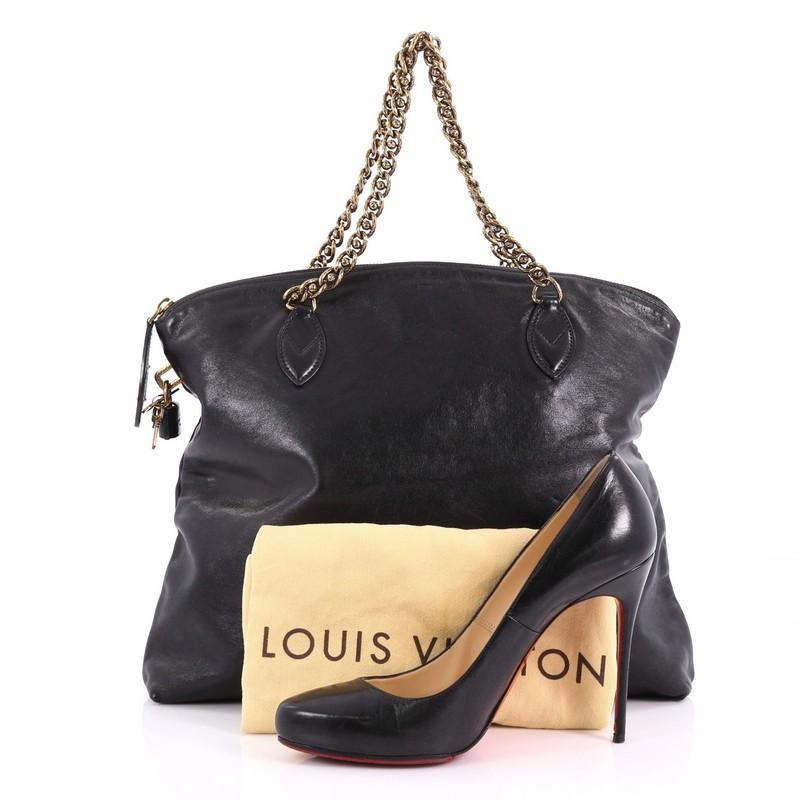 This Louis Vuitton Lockit Chain Handbag Boudoir Leather, crafted from black Boudoir leather, features signature lockit chain strap, subtle embossed LV logo at its center, and aged bronze-tone hardware. Its zip closure opens to a black leather