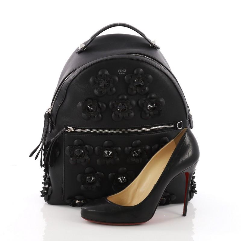 This Fendi By The Way Flowerland Backpack Embellished Leather Medium, crafted from black leather studded Flowerland flower appliqu̩es, features a flat top handle, adjustable straps, exterior front zip pocket and silver-tone hardware. Its zip closure