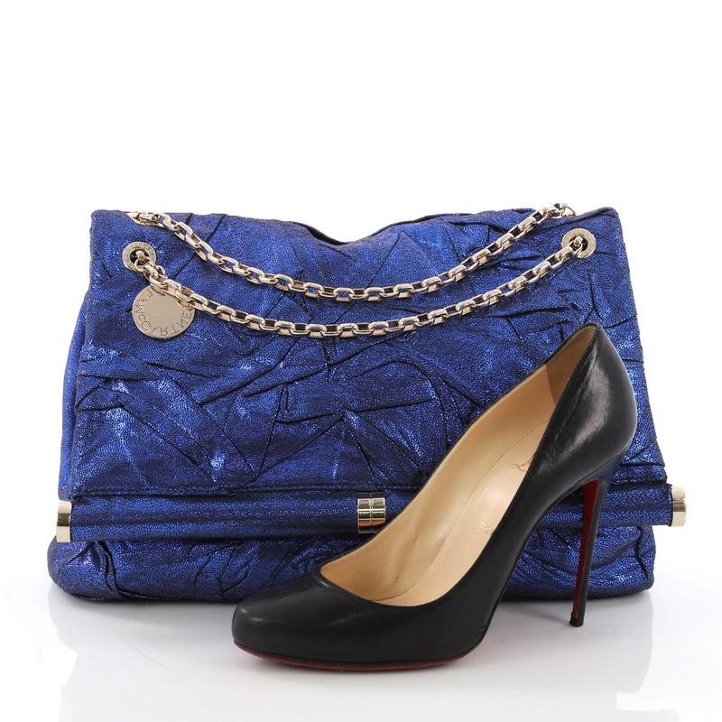 This Stella McCartney Chain Flap Bag Pleated Shaggy Deer Medium, crafted in blue pleated shaggy deer, features chain link straps and gold-tone hardware. Its flap opens to a navy satin interior. **Note: Shoe photographed is used as a sizing