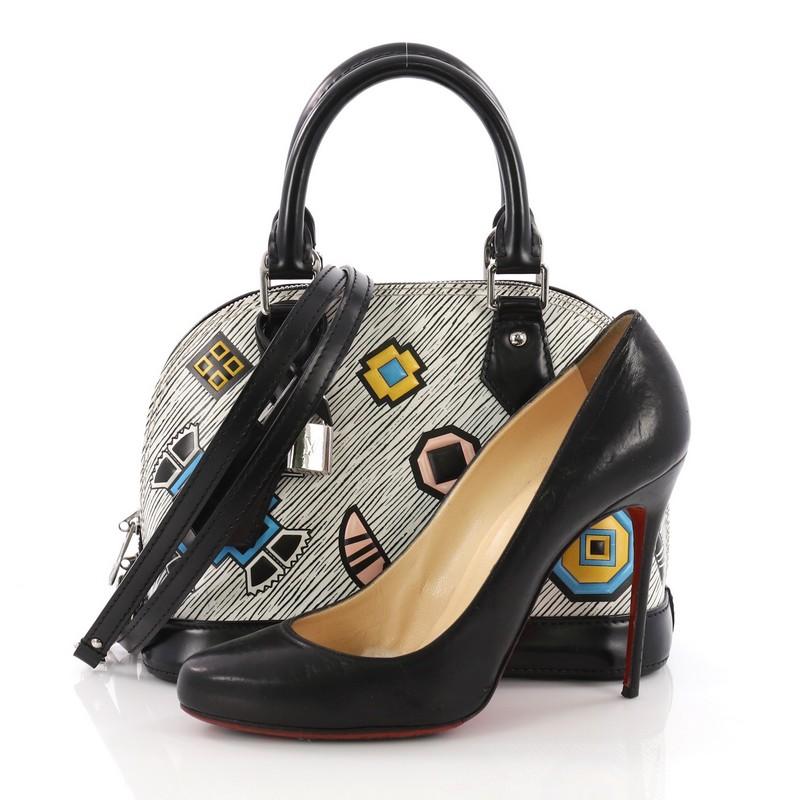 This Louis Vuitton Alma Handbag Limited Edition Azteque Epi Leather BB, crafted in printed epi leather, features dual-rolled handles, black leather base, protective base studs and silver-tone hardware. Its zip-around closure opens to a black
