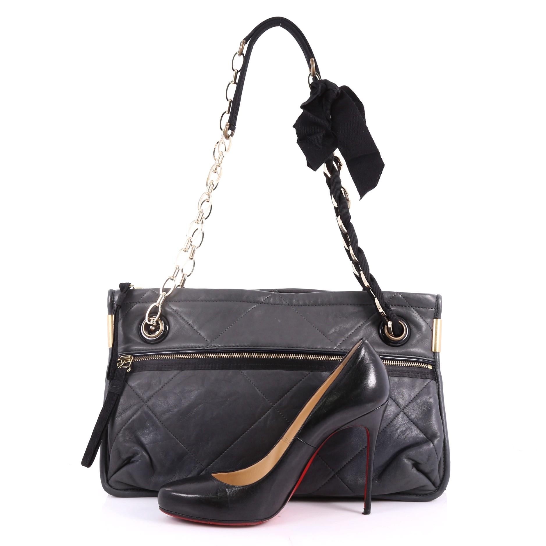 This authentic Lanvin Amalia Shoulder Bag Lambskin Medium hints at playful, modern femininity under a luxe, polished exterior. Crafted from grey quilted lambskin leather, this simple designed bag features signature chain-ribbon shoulder straps with