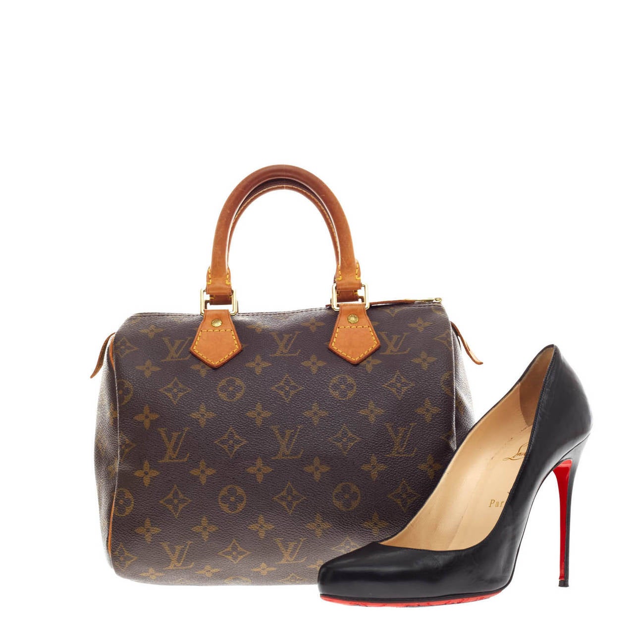 This authentic Louis Vuitton Speedy Monogram Canvas in size 25 is an iconic must-have piece. Crafted from Louis Vuitton's signature monogram print canvas, this bag features brass hardware and cowhide leather trimming and handles. This light and