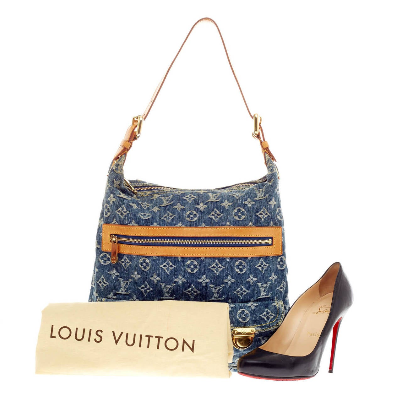 This authentic Louis Vuitton Baggy Denim size GM is a fresh twist on an iconic design that will stylishly complement a casual look. Crafted from monogram print in washed denim fabric, this bag features vachetta leather trim, yellow contrast