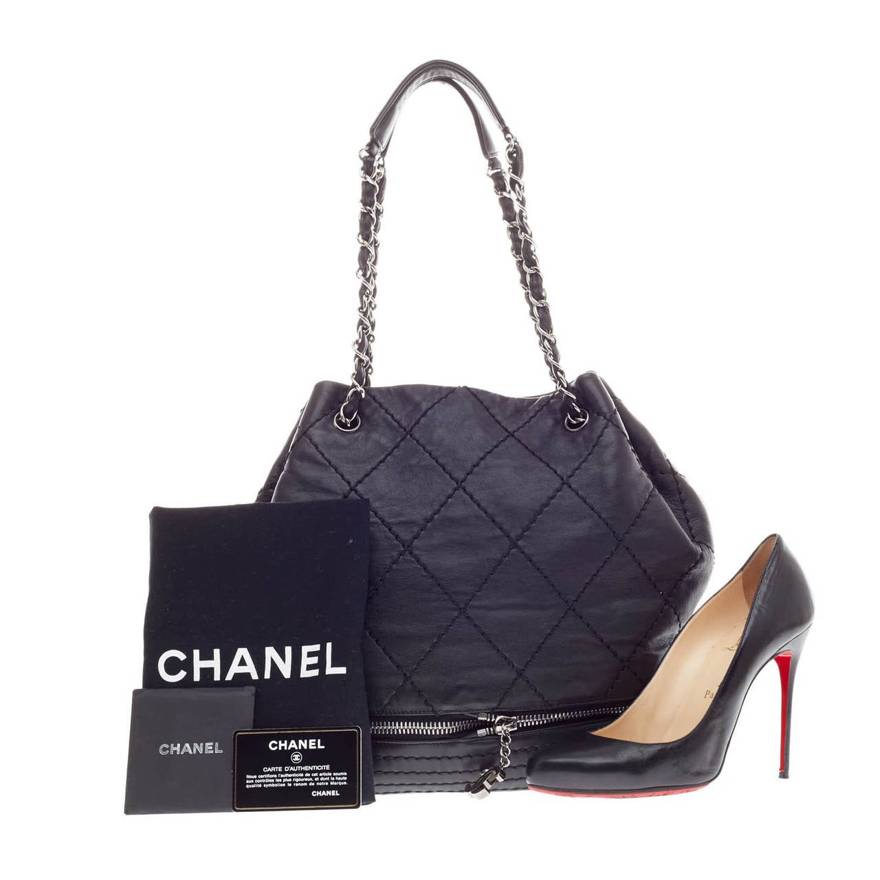 This authentic Chanel Expandable Ligne Bucket Quilted Stitched Leather size Large showcases practicality and luxury with the Chanel CC logo zipper opening to expand the height of the bag by two inches. This black bucket bag in diamond quilt