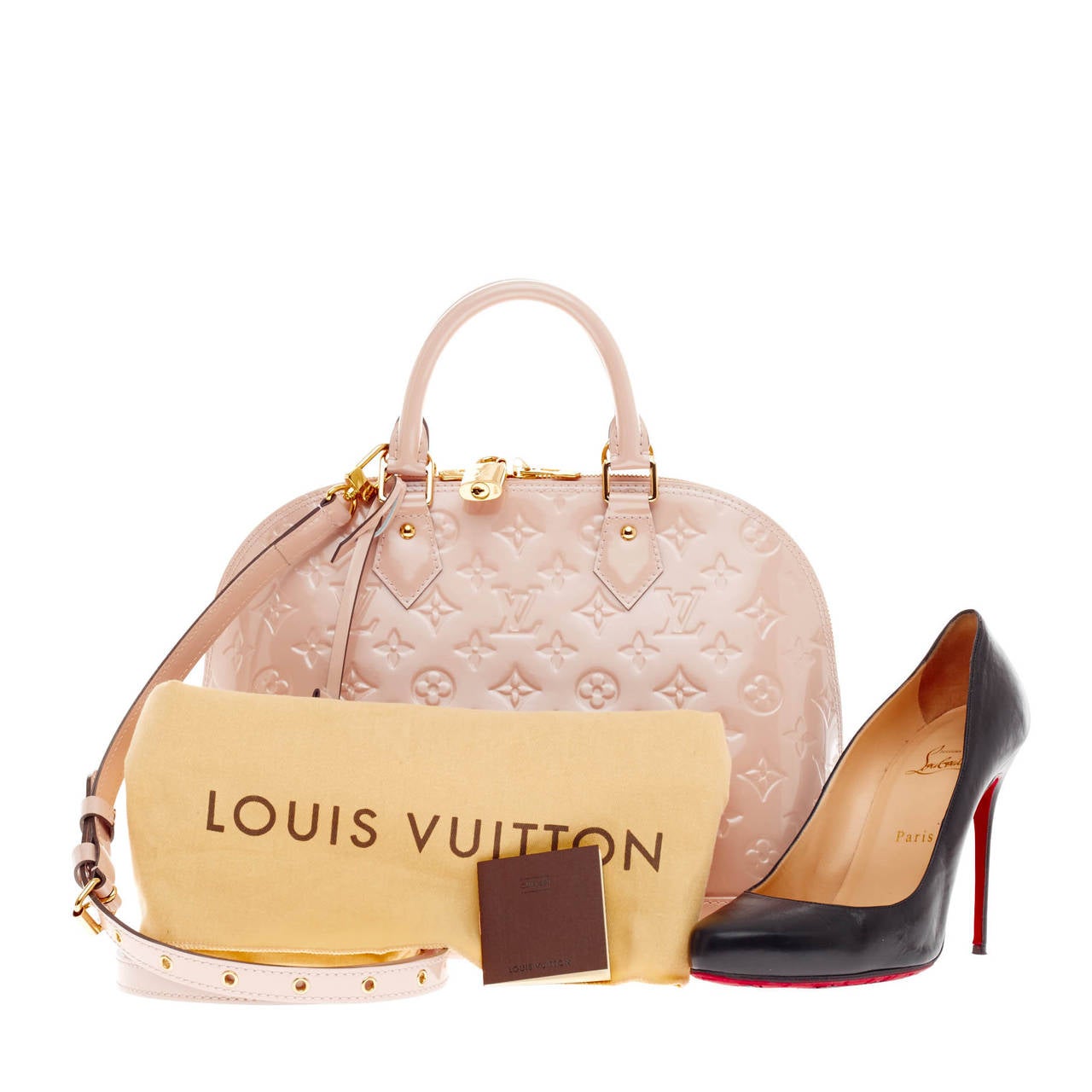 This authentic Louis Vuitton Alma Monogram Vernis PM is a fresh and elegant spin on a classic style that is perfect for spring-time looks. Crafted from Louis Vuitton's glossy vernis patent leather in stunning Rose Florentin pink, this bag features