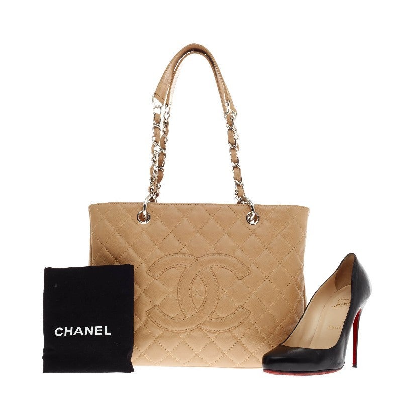 This authentic quilted Chanel Grand Shopping Tote Caviar is perfect for everyday use. This versatile tote which includes an exterior back pocket is crafted with sturdy beige caviar leather and accented with polished silver-tone hardware. The