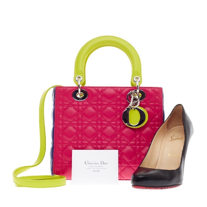 This authentic Christian Dior Lady Dior Tricolor Cannage Quilt Leather Medium is an eye-catching, bold and playful piece that every fashionista needs in her wardrobe. Crafted from tricolor fuchsia pink, royal blue and neon yellow lambskin with