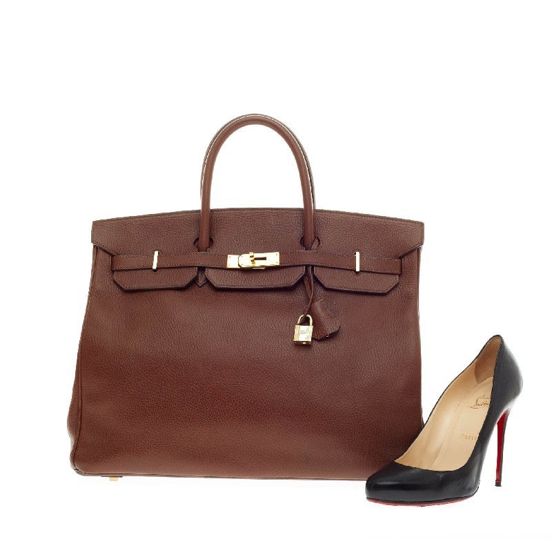 This authentic Hermes Birkin Chocolate Ardennes with Gold Hardware 40 stands as one of the most-coveted bags fit for any fashionista. Constructed from sturdy, scratch-resistant brown ardennes leather, this stand-out oversized tote features
