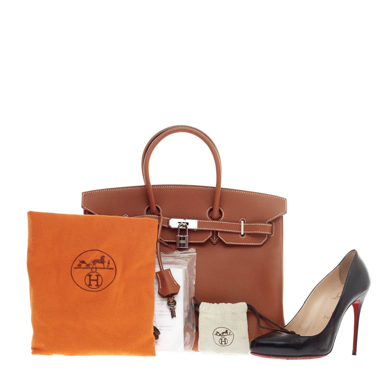 This authentic Hermes Birkin Gold Epsom Palladium Hardware 35 showcases Hermes' most beloved and classic design. Constructed in sturdy, scratch-resistant cross grain gold epsom leather with white contrast stitching, this stand-out neutral tote