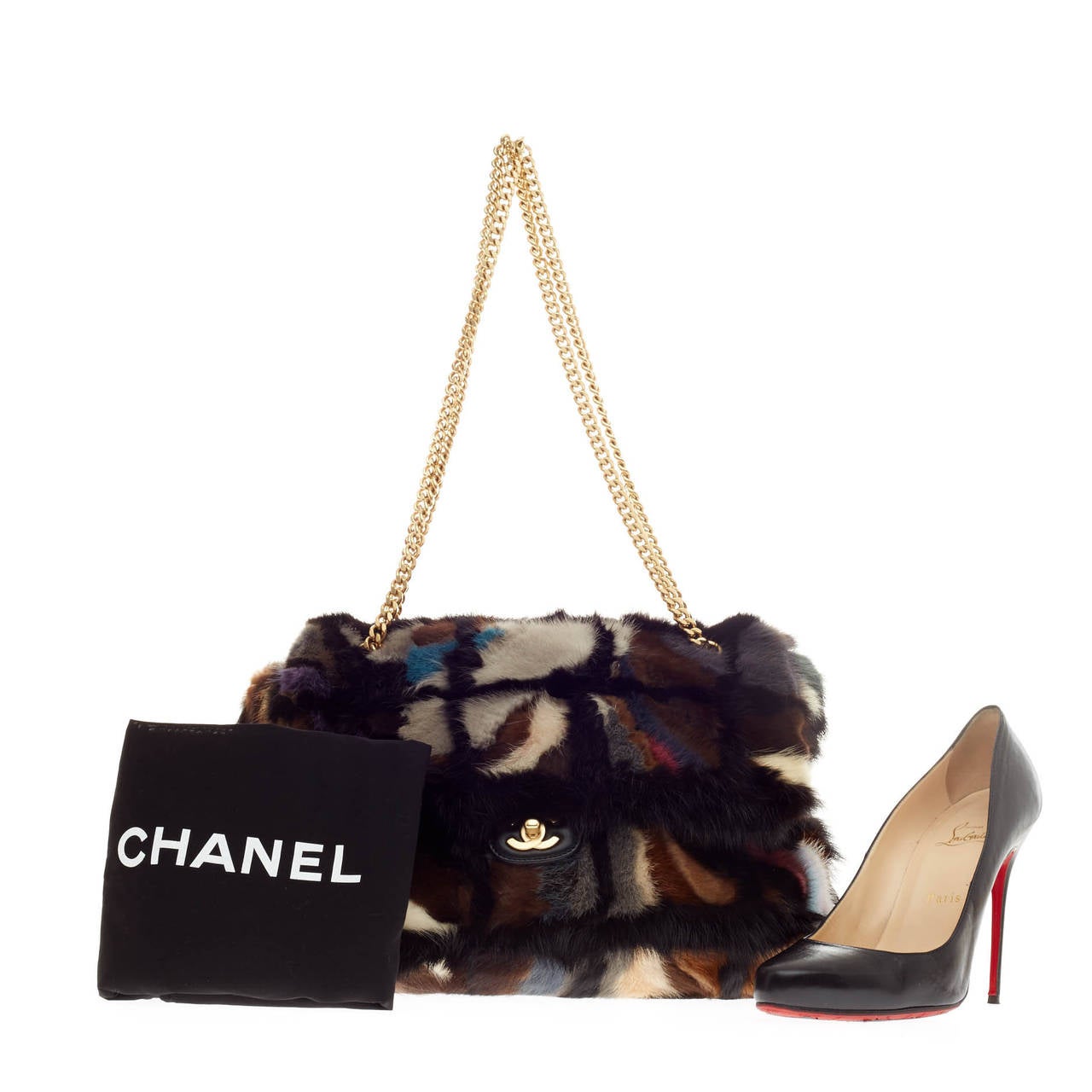 This authentic Chanel Arm Candy Multicolor Flap Mink in size Large presented in Chanel's Fall/Winter 2001 Collection is a perfect companion with its exquisite style and elegant look for the boldest of fashionistas. Beautifully crafted in genuine