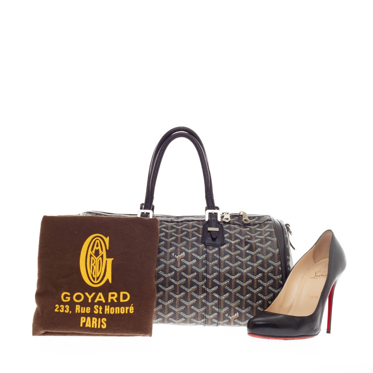 This authentic Goyard Croisiere Canvas 35 is an exclusive chic tote perfect for every fashionista. Crafted from Goyard's iconic black, white and brown chevron print in coated canvas, this no-fuss duffle features dual-rolled leather top handles,