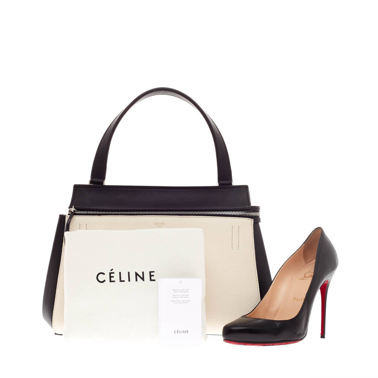 This authentic Celine Edge Bag Leather Small showcases the brand's simplicity and understated modern design perfect for the modern woman. Crafted in contrasting cream and black leather, this structured bag displays a single looped black strap,