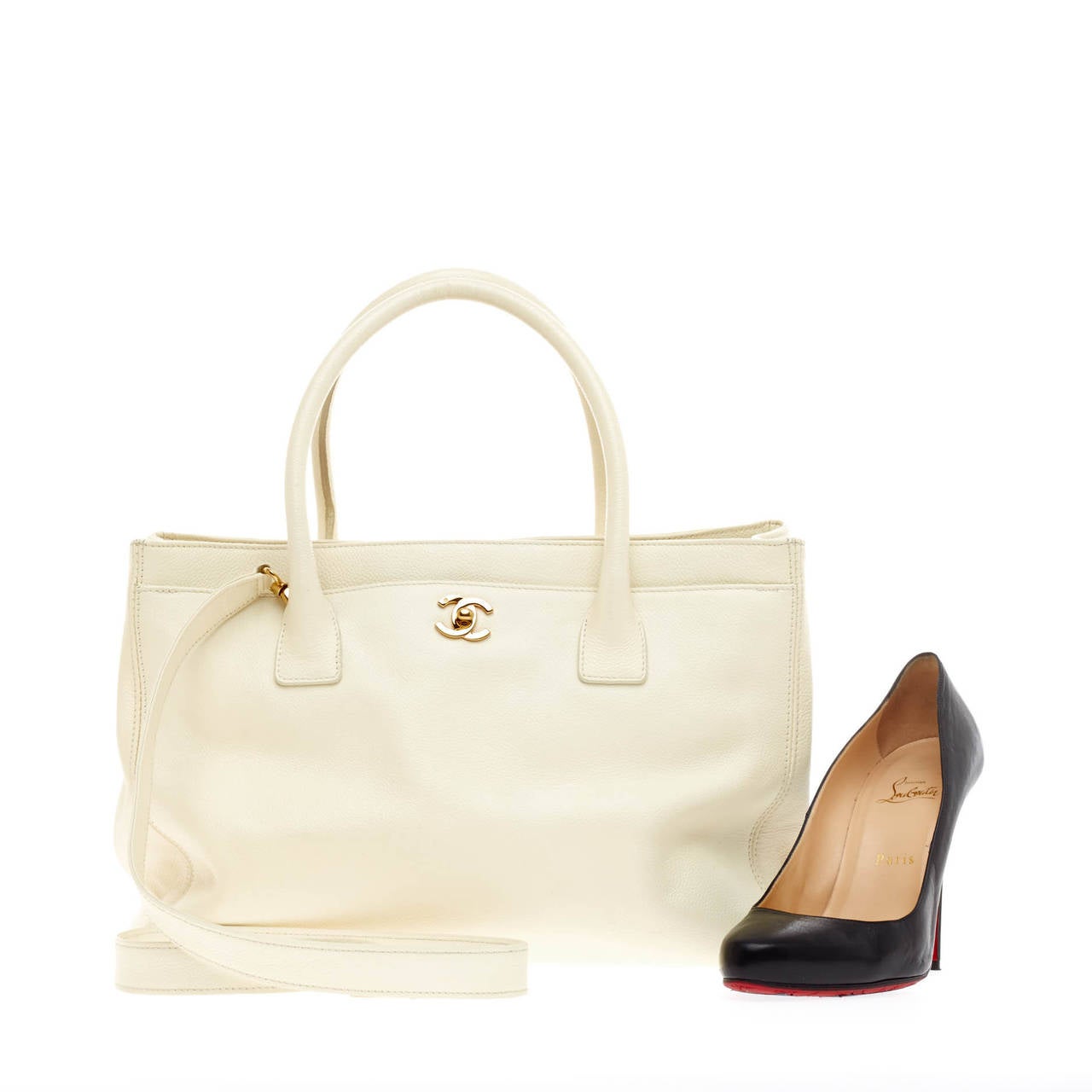 This authentic Chanel Cerf Executive Tote Leather Medium is ideal everyday accessory for the modern woman. Crafted in vivid white caviar leather, this classic and functional tote features signature gold-tone CC hardware that opens the exterior front