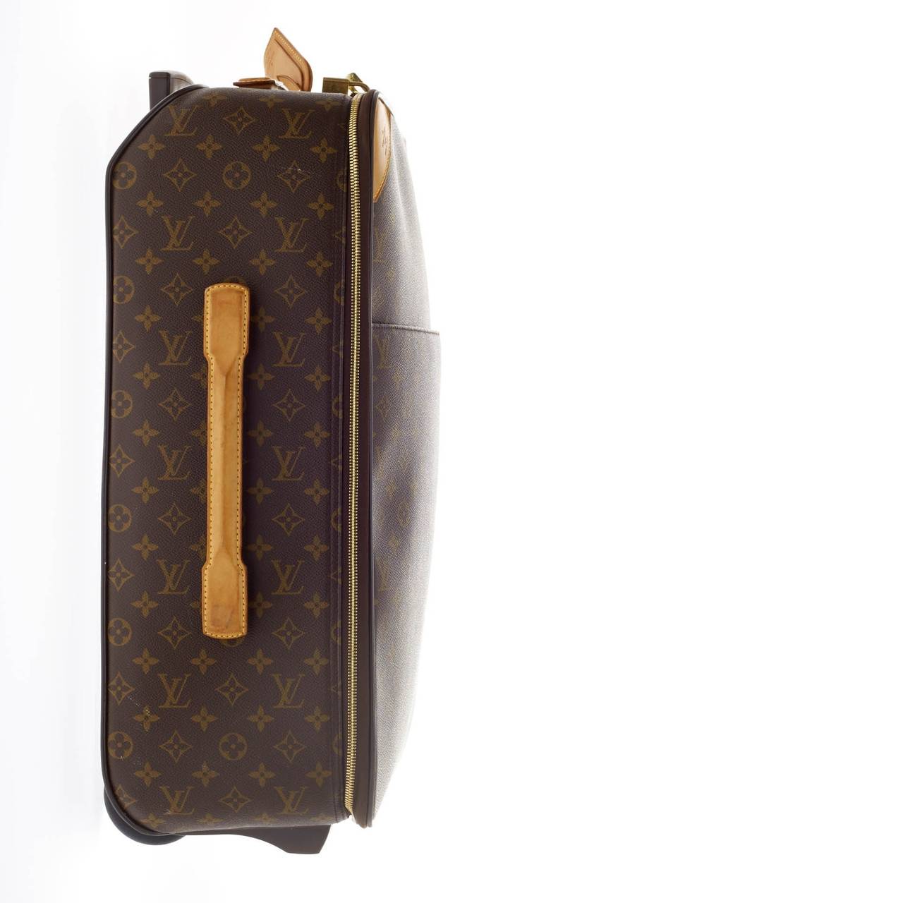 This authentic Louis Vuitton Pegase Monogram Canvas 55 is a sleek and sturdy suitcase for all your travels. Crafted from Louis Vuitton's iconic monogram canvas exterior, this functional luggage features cowhide leather trimmings and luggage tags,