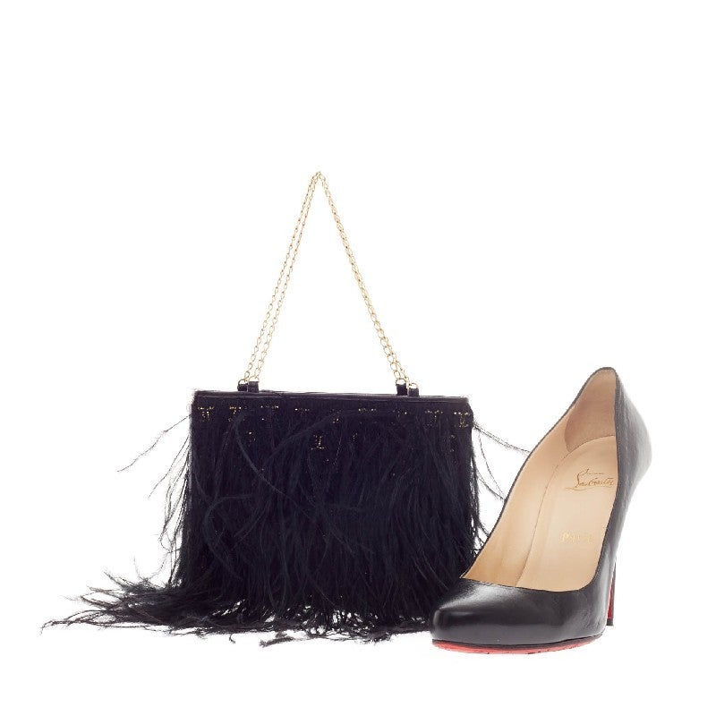 This authentic Chanel Chain Strap Shoulder Bag Ostrich Feather is perfect for night outs. Crafted in genuine black cascading ostrich feathers, this unique bag features a matte gold chain strap with all-over gold signature CC beading underneath its