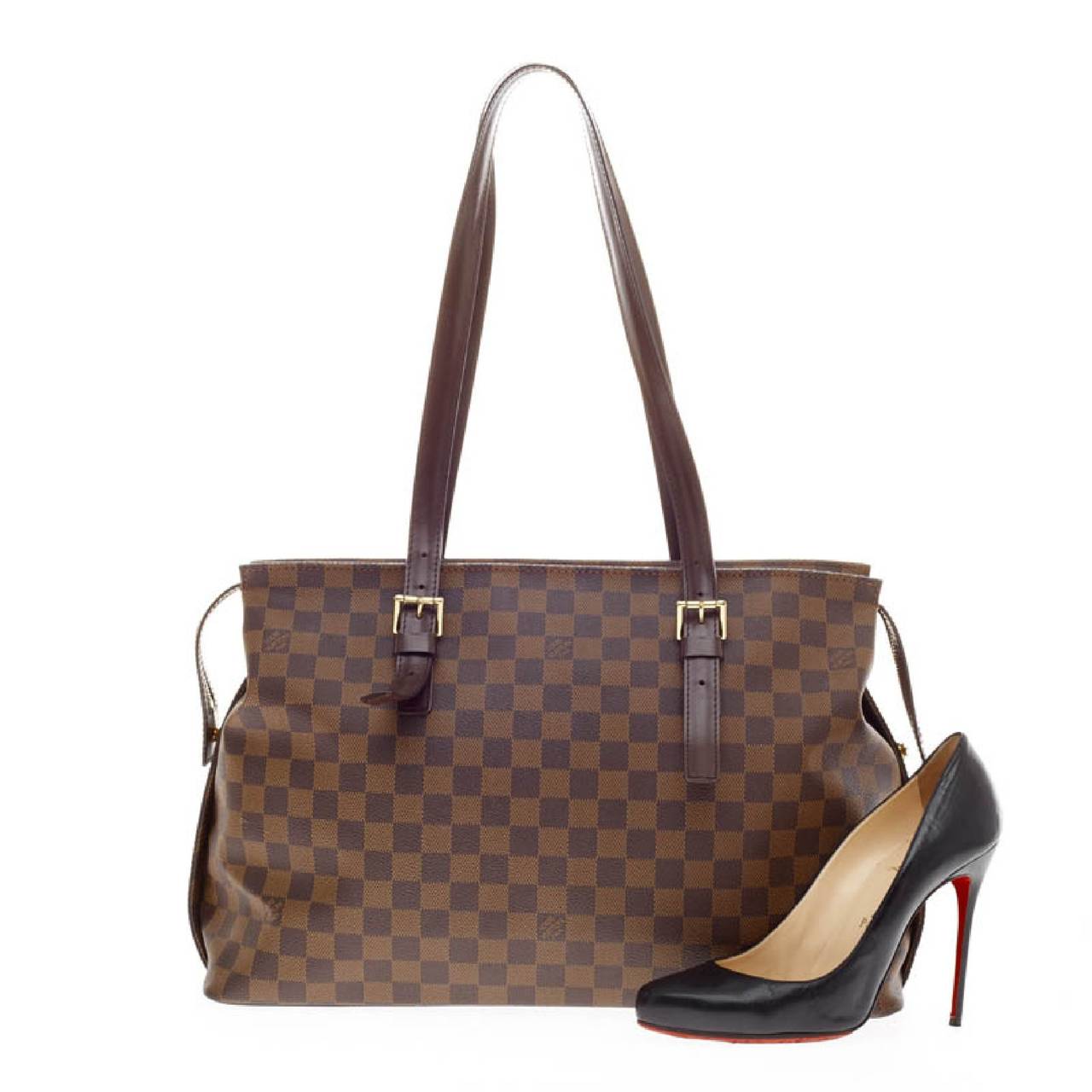 This authentic Louis Vuitton Chelsea Tote Damier combines Louis Vuitton's classic style with sophisticated functionality. It is constructed with the classic Damier Ebene monogram canvas and dark brown leather trims.This coated canvas tote features a