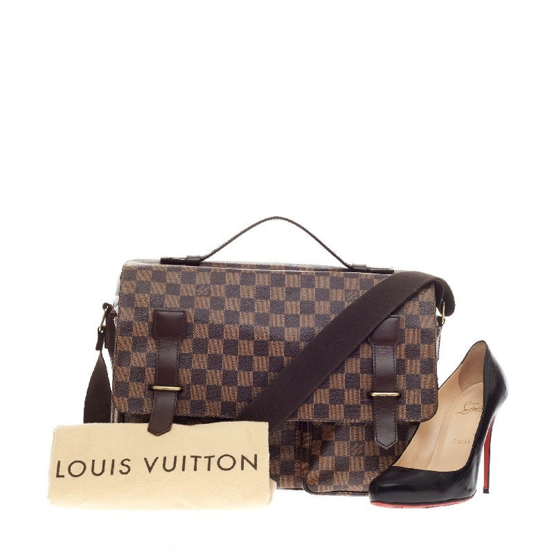 This authentic Louis Vuitton Broadway Messenger Bag Damier is luxurious and functional everyday bag. Crafted in Louis Vuitton's signature damier ebene print, this heritage-inspired messenger bag features dark brow leather trimmings, adjustable