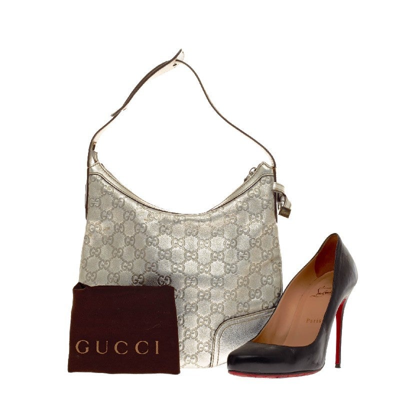 This authentic Gucci Princy Hobo Guccissima Leather in Small is the perfect compact flat hobo to carry by your side. Constructed in metallic silver guccissima monogram leather, this classic shoulder bag features a top zipper closure, and a single