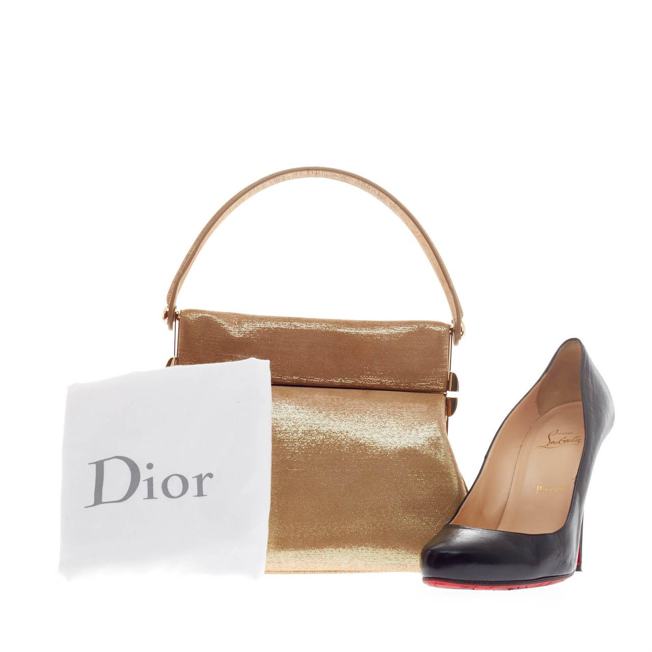 This authentic Christian Dior Babe Vanity Shoulder Bag Metallic Suede is a statement piece you can surely take from day to night. Crafted with beige and metallic suede, this vintage-inspired feminine bag features a single rolled handle, four base