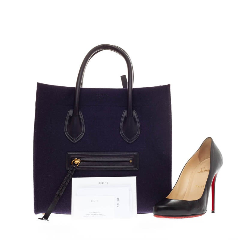 This authentic Celine Phantom Felt and Leather Detail Medium debuting in Celine's Fall 2014 collection is the perfect understated accessory to add modern style to any outfit. Crafted in deep purple felt and black leather trimmings, this oversized