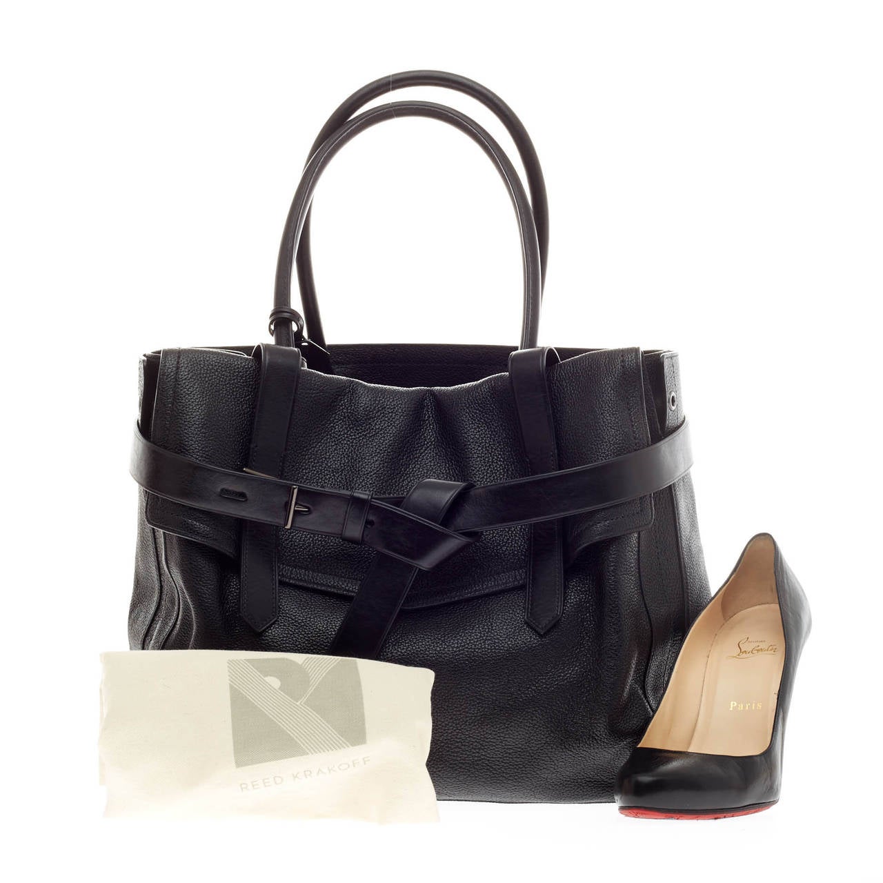 This authentic Reed Krakoff Boxer Tote Leather Medium is a versatile, functional bag that complements both dressy and casual looks perfect for the modern woman. Constructed in slouchy black pebbled leather, this no-fuss tote version features