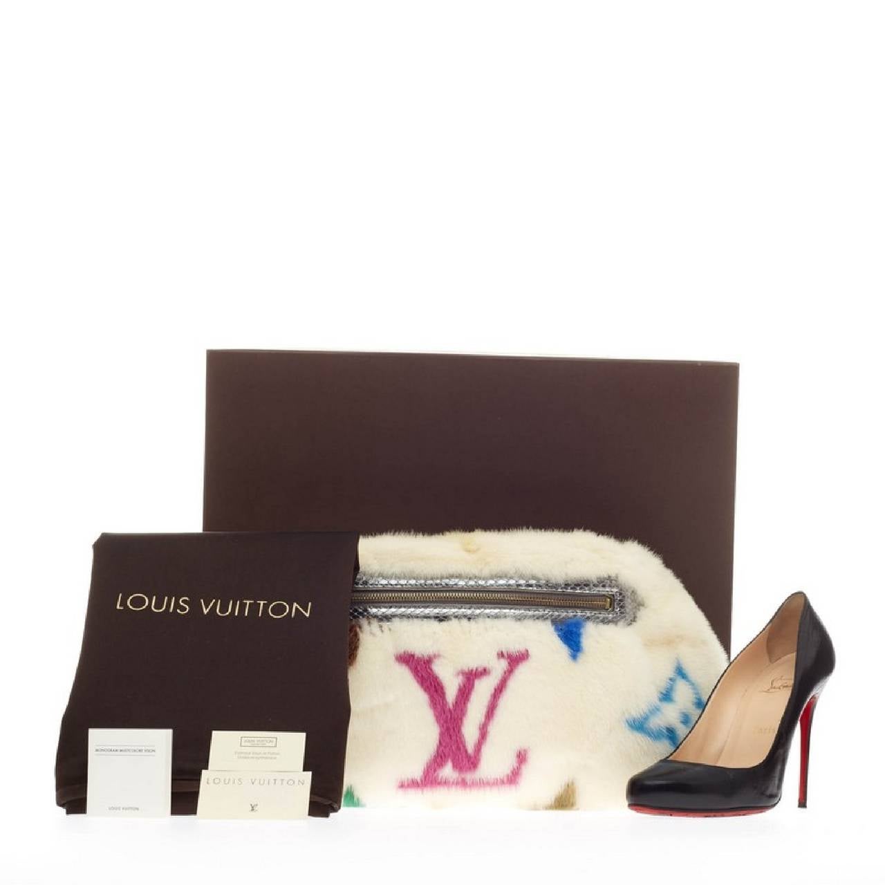 This authentic hard-to-find Louis Vuitton Bum Bag Limited Edition Multicolor Monogram Mink designed in the brand's Fall/Winter 2006 Les Extraordinaires Collection exudes avant-garde style perfect for Louis Vuitton lovers. Crafted in stylish