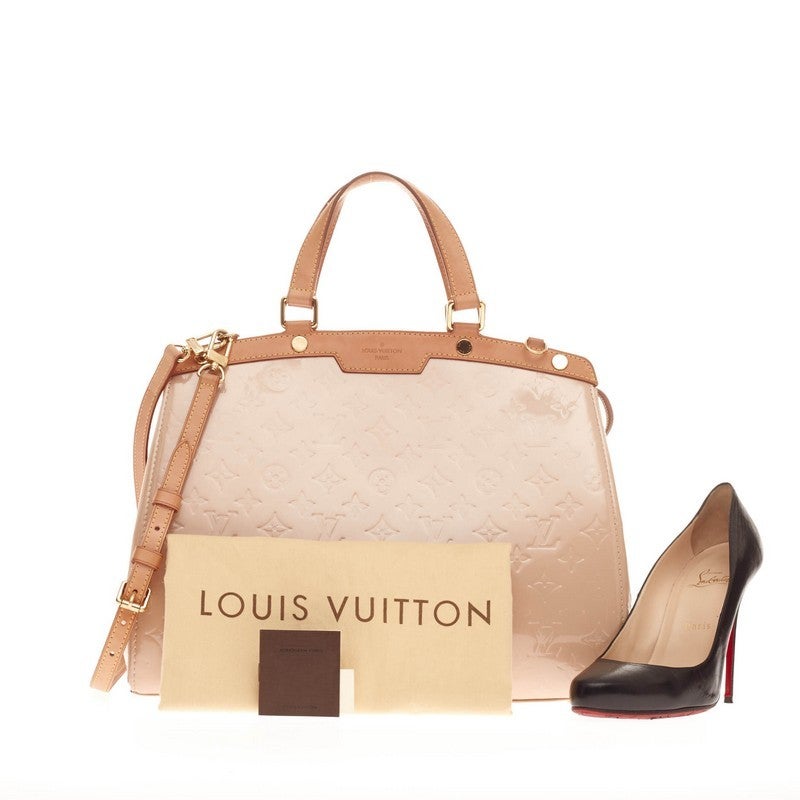 This authentic Louis Vuitton Brea Monogram Vernis GM is a staple for an everyday casual look. Crafted in dusty Rose Florentin monogram vernis with cowhide trimmings, this structured yet feminine tote features stand-out yellow contrast stitching,