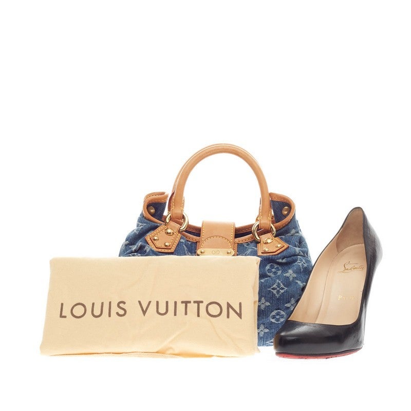This authentic Louis Vuitton Pleaty Denim in Small is a playfully chic piece to accessorize a casual look. This unique top handle bag features a washed denim fabric exterior with Louis Vuitton's signature monogram print, cowhide leather handles and