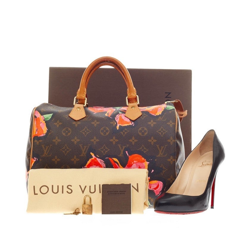 This authentic Louis Vuitton Speedy Limited Edition Monogram Canvas Roses 30 for its 2009 Collection is created by Marc Jacobs as a tribute to the late artist, Stephen Sprouse. Crafted in the brand's signature monogram on coated canvas with