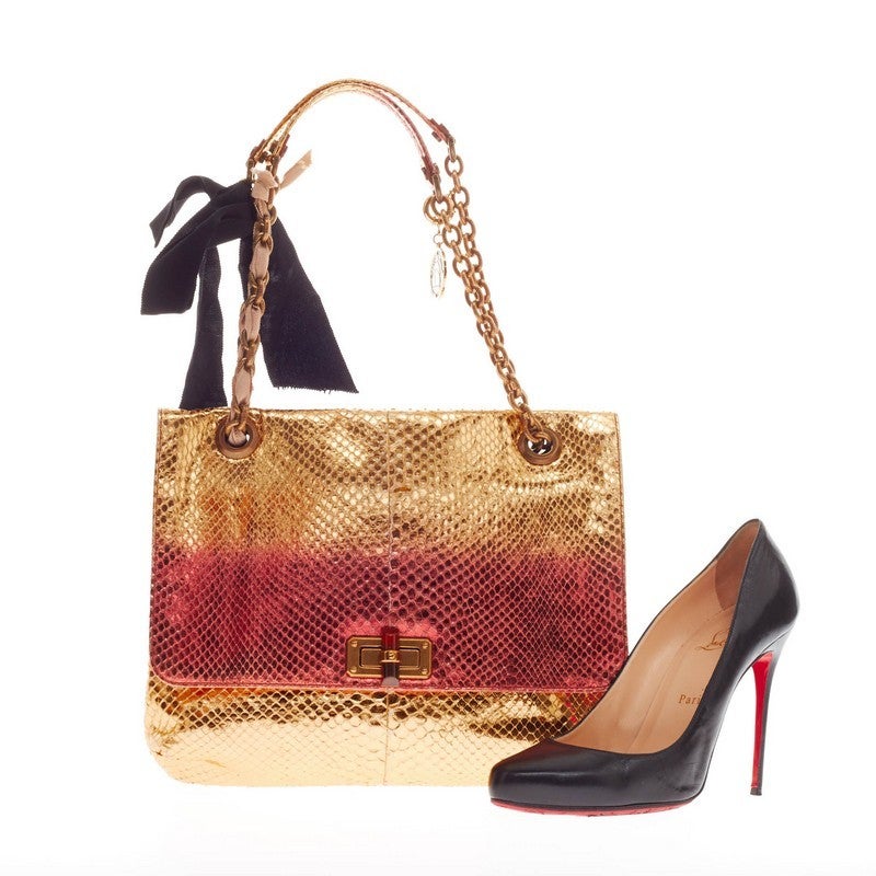This authentic Lanvin Happy Shoulder Bag Metallic Python presented in the brand's 2010 Collection mixes the brand's popular style with a chic flair. Designed in metallic gold and red ombre python skin, this fold-over flap satchel features brass