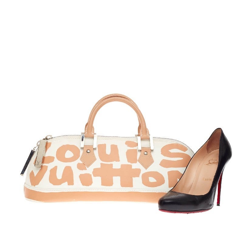 This authentic Louis Vuitton Alma Monogram Graffiti Horizontal designed by Stephen Sprouse the brand's Graffiti Collection balances sophisticated style with a playful twist. Constructed in smooth white leather with Louis Vuitton's peach monogram