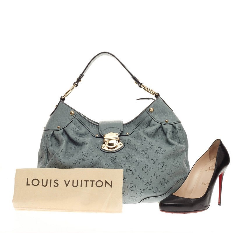 This authentic Louis Vuitton Solar Mahina Leather PM is an easy, feminine design constructed with intricate perforated monogram in beautiful blue ciel mahina leather. Showcased in the brand's Spring/ Summer 2010 Collection, this elegant and roomy