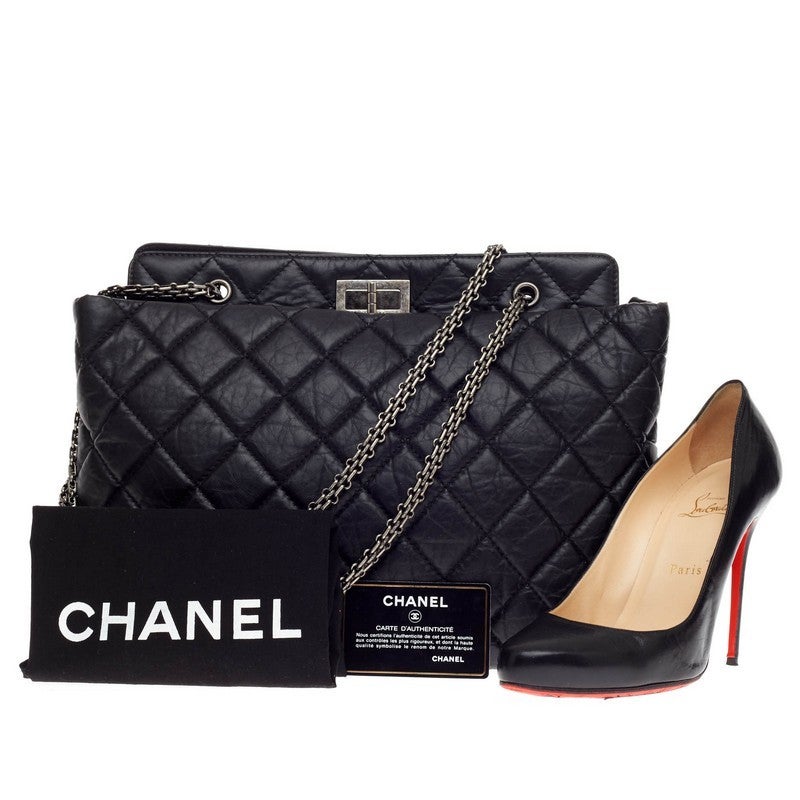 This authentic Chanel Reissue 2.55 Shopping Tote Aged Quilted Calfskin is eye-catching and understated showcasing a reinterpretation of the brand's classic reissue design. Crafted in black diamond quilted aged calfskin leather, this slightly puffed