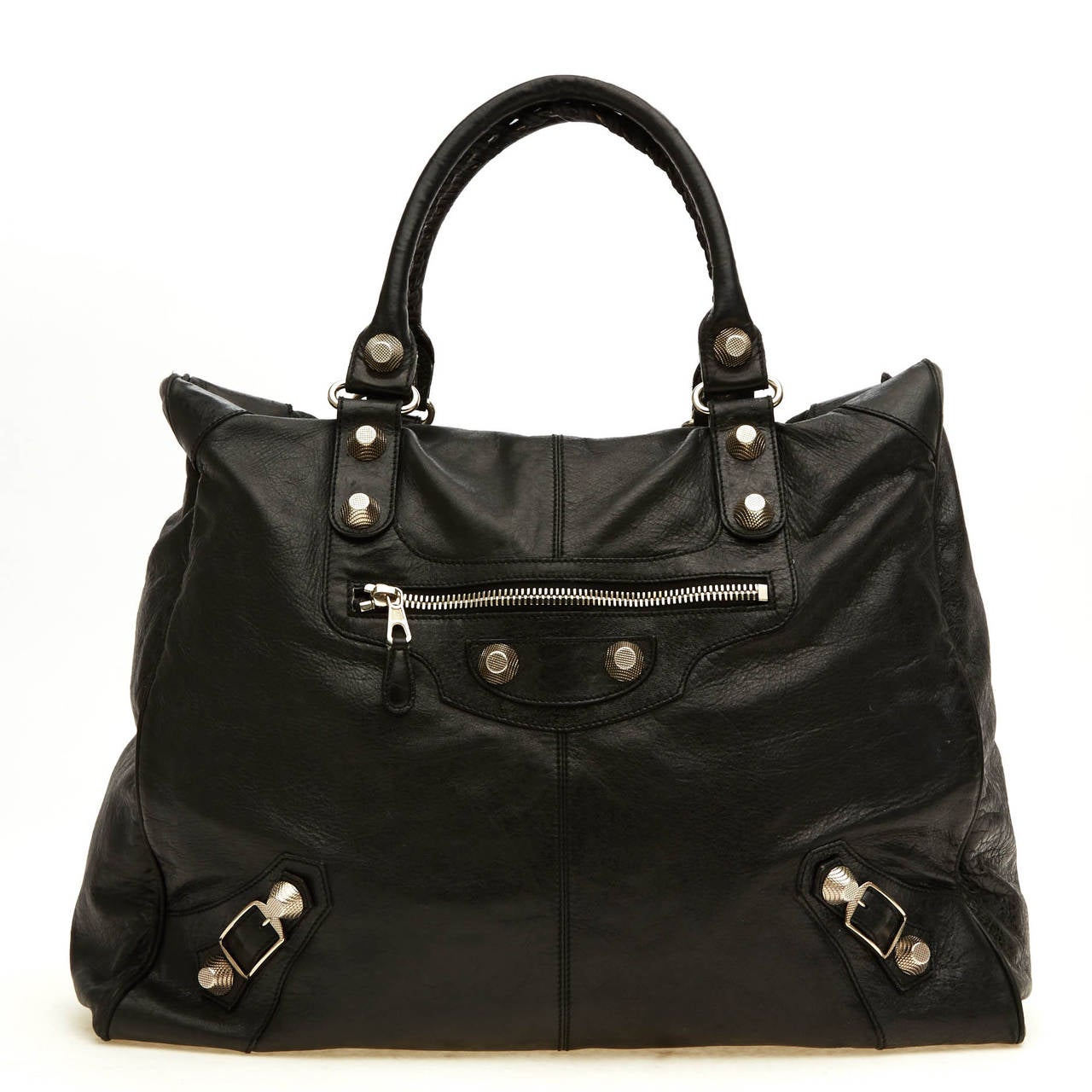 This stunning Balenciaga Weekender with Giant Studs is an instant luxurious classic. This desirable bag, constructed with soft deep black leather, features giant silver hardware and zipper details. This bag is very spacious, yet east to carry - it