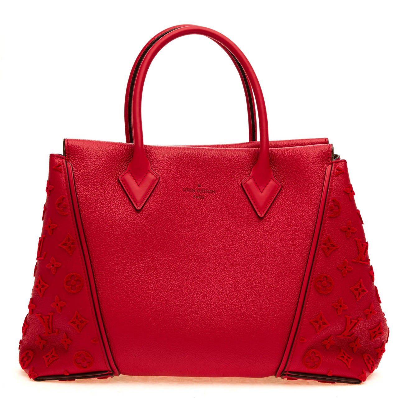 This Louis Vuitton Veau Cachemire W Tote in size PM is constructed with an innovative shape and design. It is accented with golden brass metal details, and the Louis Vuitton signature embossed onto the leather sides. This rosy red bag also features