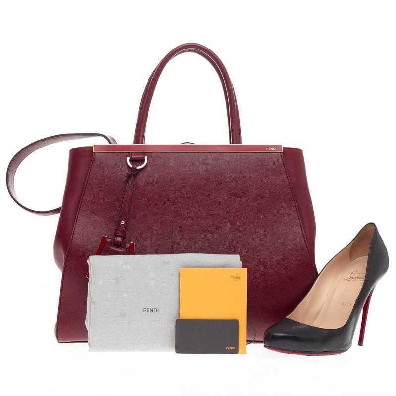 This authentic Fendi 2Jours Leather Medium is impeccably stylish with its vivid lipstick red hue, and simple silhouette. Finely crafted in sturdy cross-grain leather with soft calfskin sides, this chic tote is accented with a shining top bar that