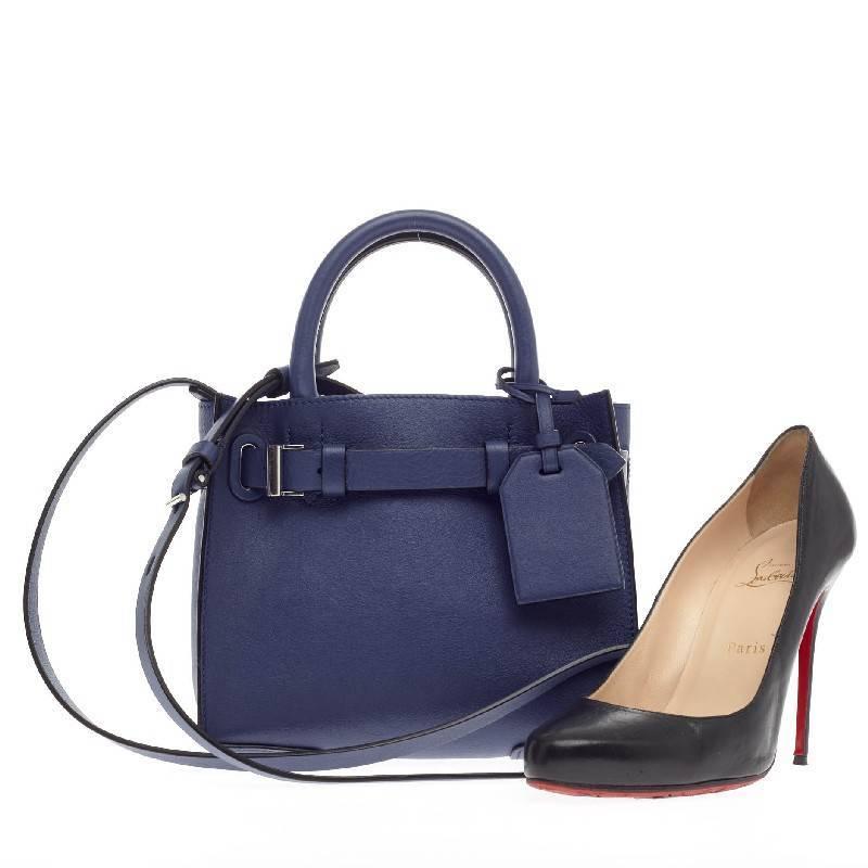 This authentic Reed Krakoff RK40 Tote Leather Small crafted from vivid navy blue leather is a versatile, structured petite bag that complements both dressy and casual looks. Featuring interior and exterior pockets, dual-rolled handles and a