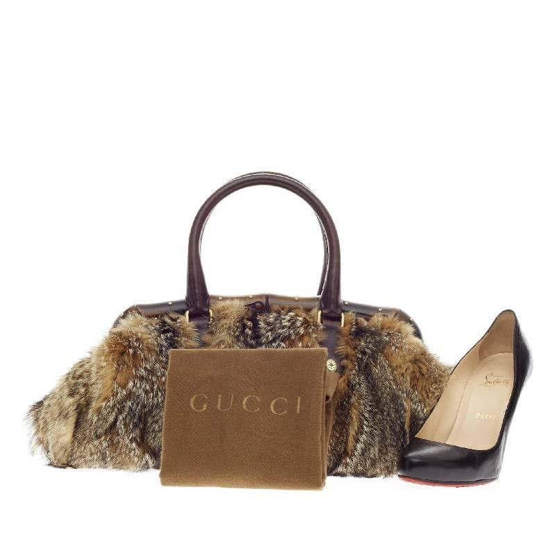 This authentic Gucci Bamboo Frame Satchel Fur is one-of-a-kind piece only for the boldest of fashionistas. Crafted in genuine soft natural fur, this luxurious doctor-style frame bag features Gucci's iconic bamboo frame top with miniature gold studs