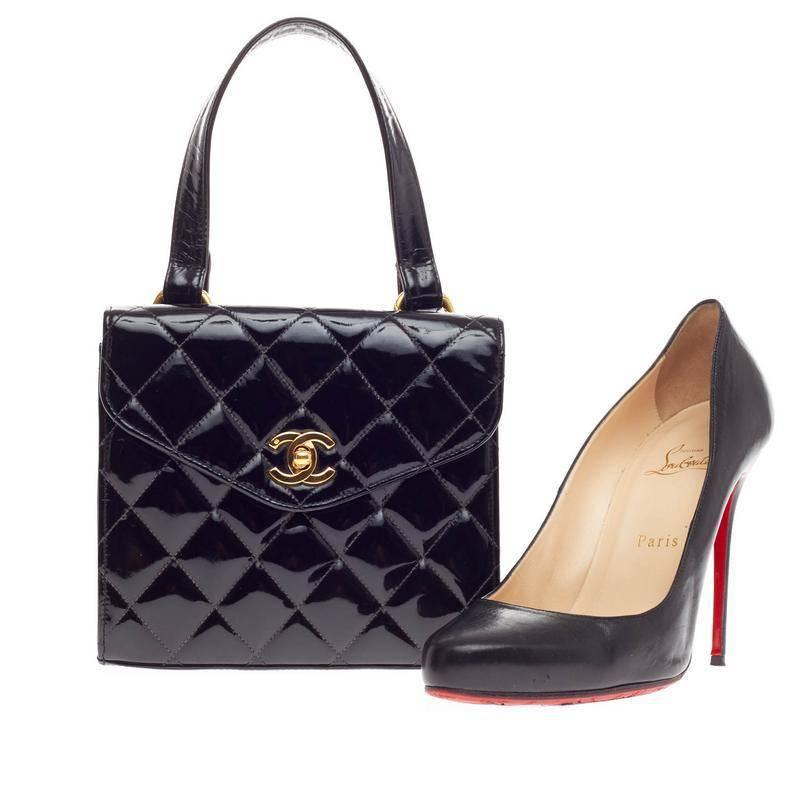 This authentic Chanel Vintage Box Flap Bag Quilted Patent Small is a timeless piece made for any fashionable woman. Constructed from black patent leather in Chanel's signature diamond quilting, this petite, structured handle bag features a CC