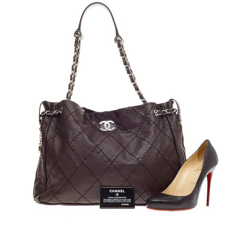 This authentic Chanel Expandable Zip Around Tote Stitched Leather is perfect for the modern woman. Crafted in brown stitched quilted leather, this chic tote features an iconic CC logo on the front, zip around details for expansion with Chanel CC