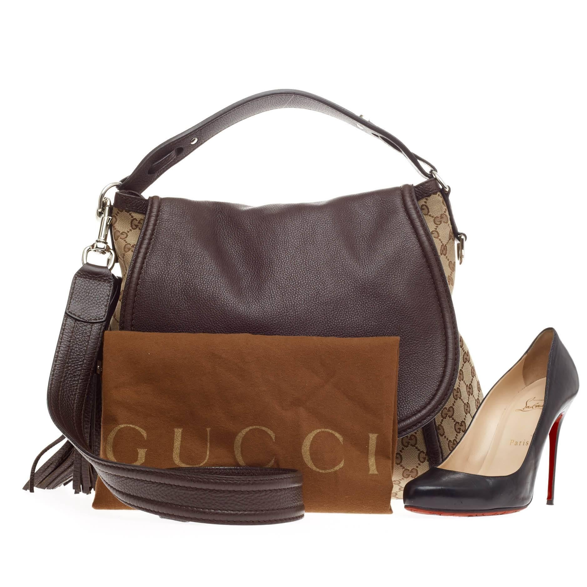 This authentic Gucci Techno Horsebit Flap Hobo Leather and GG Canvas Large is simple yet sophisticated in design perfect for modern-chic fashionistas. Crafted in brown GG canvas with brown leather, this chic hobo features Gucci's modern silver