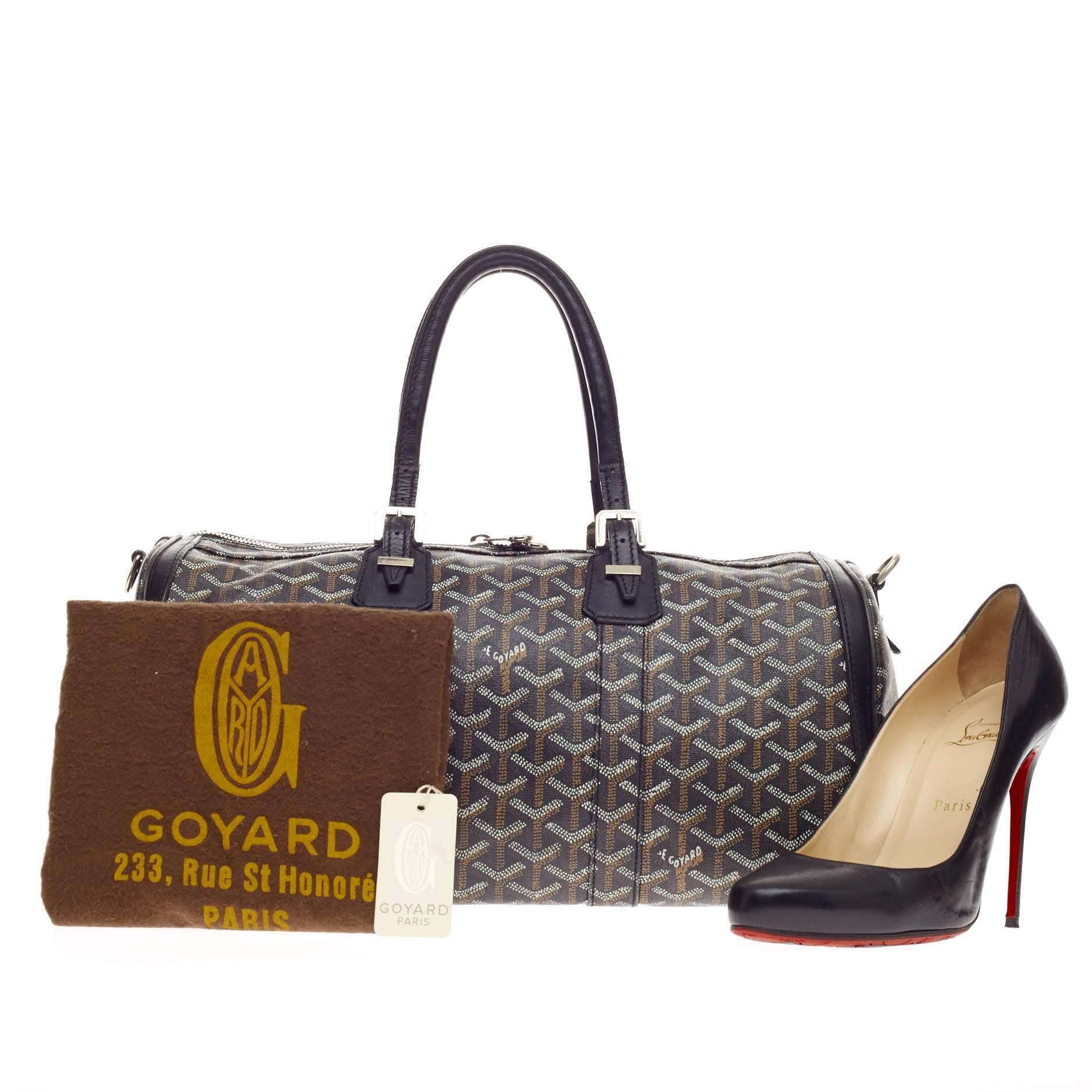 This authentic Goyard Croisiere Canvas 40 is an exclusive chic tote perfect for every fashionista. Crafted from Goyard's iconic black, white and brown chevron print in coated canvas, this luxe duffle features dual-rolled leather top handles, buckle