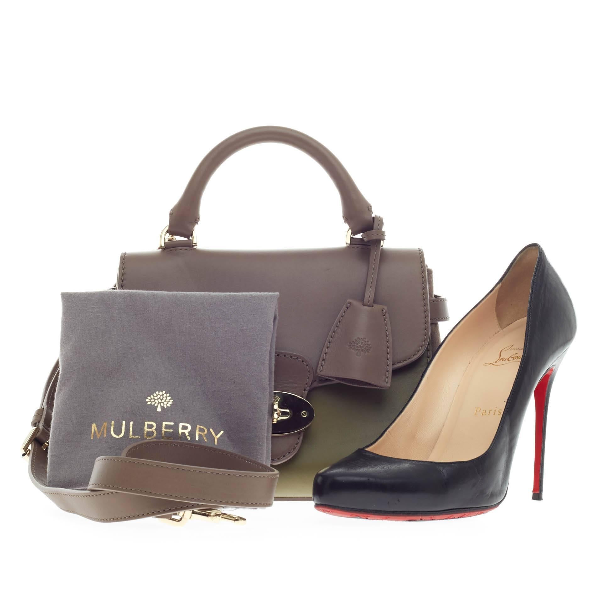 This authentic Mulberry Primrose Satchel Leather is perfect for on-the-go fashionistas. Crafted in bicolor olive green and taupe leather with taupe suede panels on both sides, this 2013 Collection chic satchel features a dual-rolled top handle,