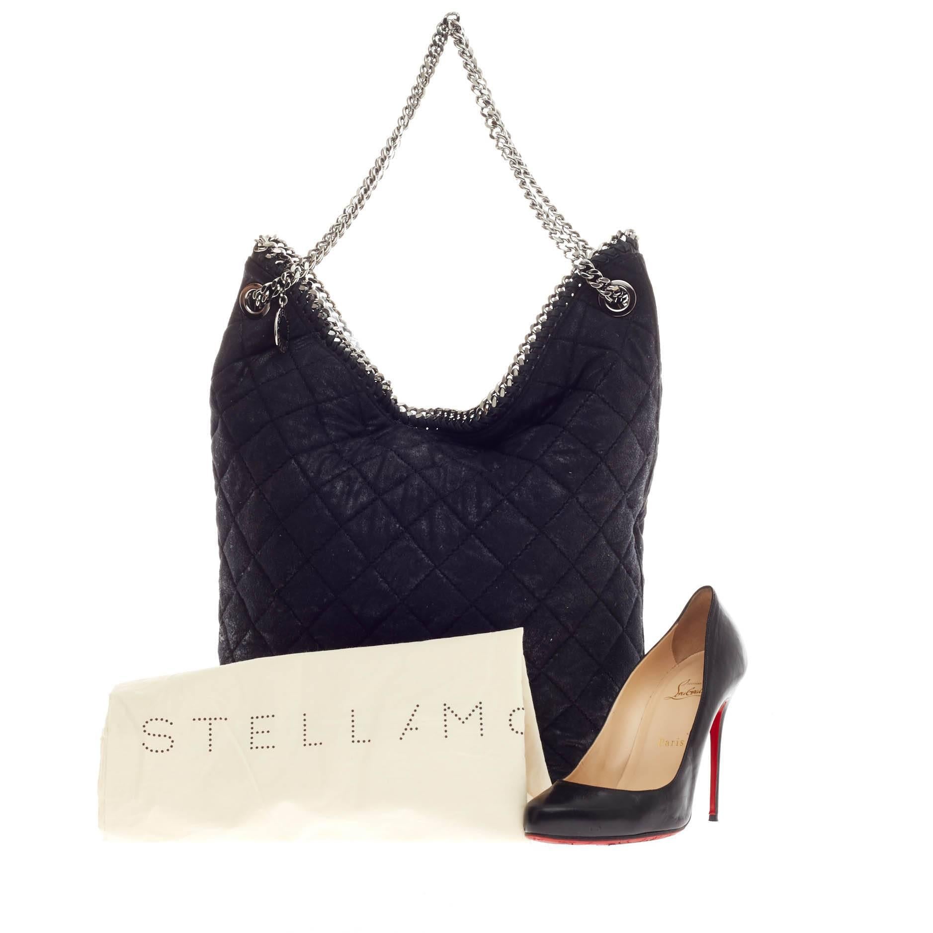 This authentic Stella McCartney Falabella Bucket Quilted Faux Leather is perfectly textured with shimmery black distressed and quilted faux leather that is chic yet understated. This slouchy, no-fuss bucket bag features whipstitched edges, silver