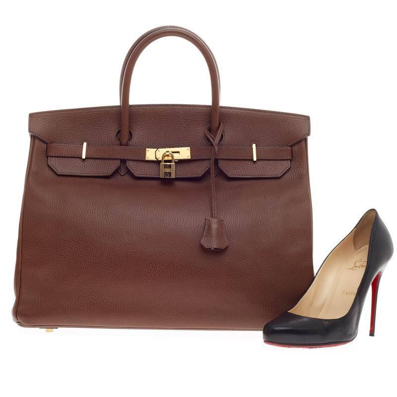 This authentic Hermes Birkin Chocolate Ardennes with Gold Hardware 40 stands as one of the most-coveted bags fit for any fashionista. Constructed from sturdy, scratch-resistant brown ardennes leather, this stand-out oversized tote features