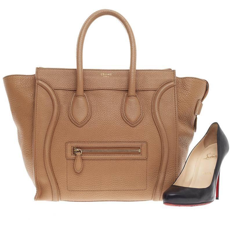 This authentic Celine Luggage Grainy Leather Mini epitomizes Phoebe Philo's minimalist yet chic style. Constructed in camel grainy leather with gold-tone hardware accents, this popular tote features a front zipper pocket, top zip closure,