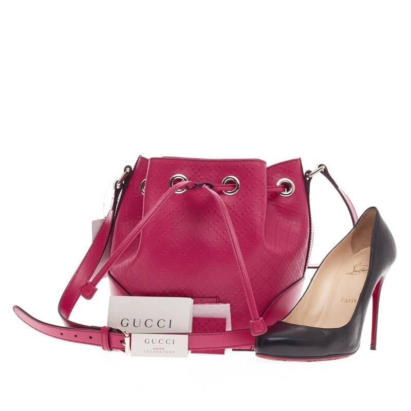 This authentic Gucci Bright Bucket Bag Diamante Leather Small is sophisticated and modern in style perfect for everyday use. Crafted in Gucci’s diamante leather in hot pink leather, this stylish bucket bag features an adjustable leather straps and