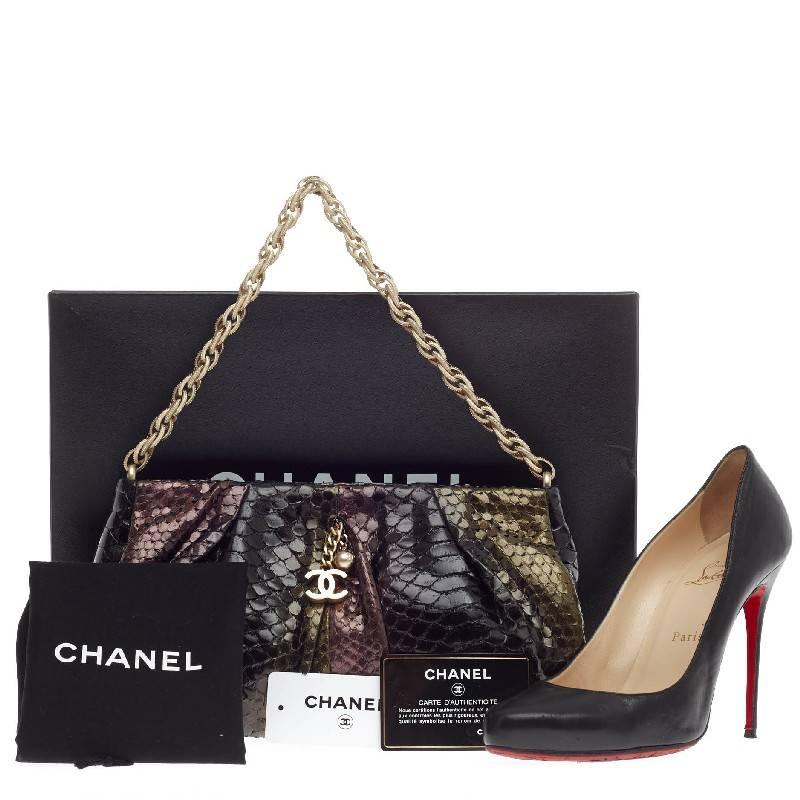 This authentic Chanel Chain Strap Pochette Python will certainly add a pop of style to any casual and evening outfit. Constructed in luxurious multicolor ombre black, green and deep purple python skin, this pleated clutch features a matte gold